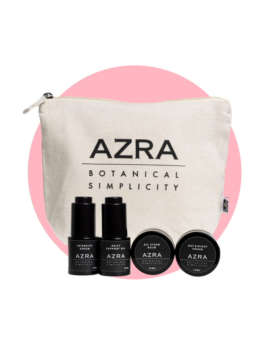 AZRA Travel Essentials – putni i poklon set 4 × 15 ml na ružičastoj podlozi